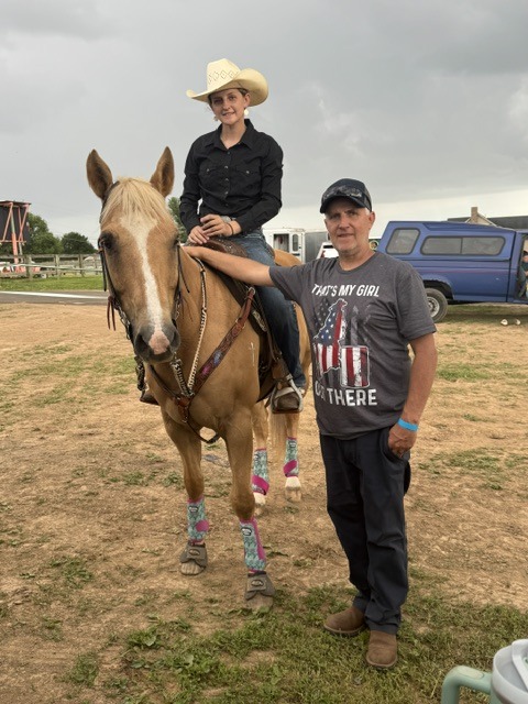 Rylen on horseback with her dad