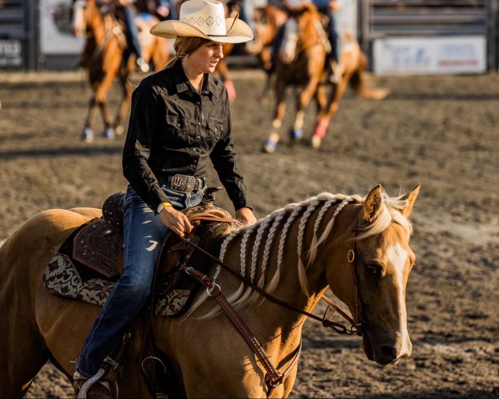 Rylen in western attire on a braided palomino
